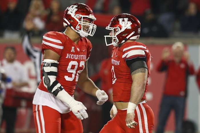 Houston defensive lineman Logan Hall celebrates tackle